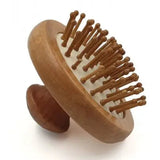Round wooden comb